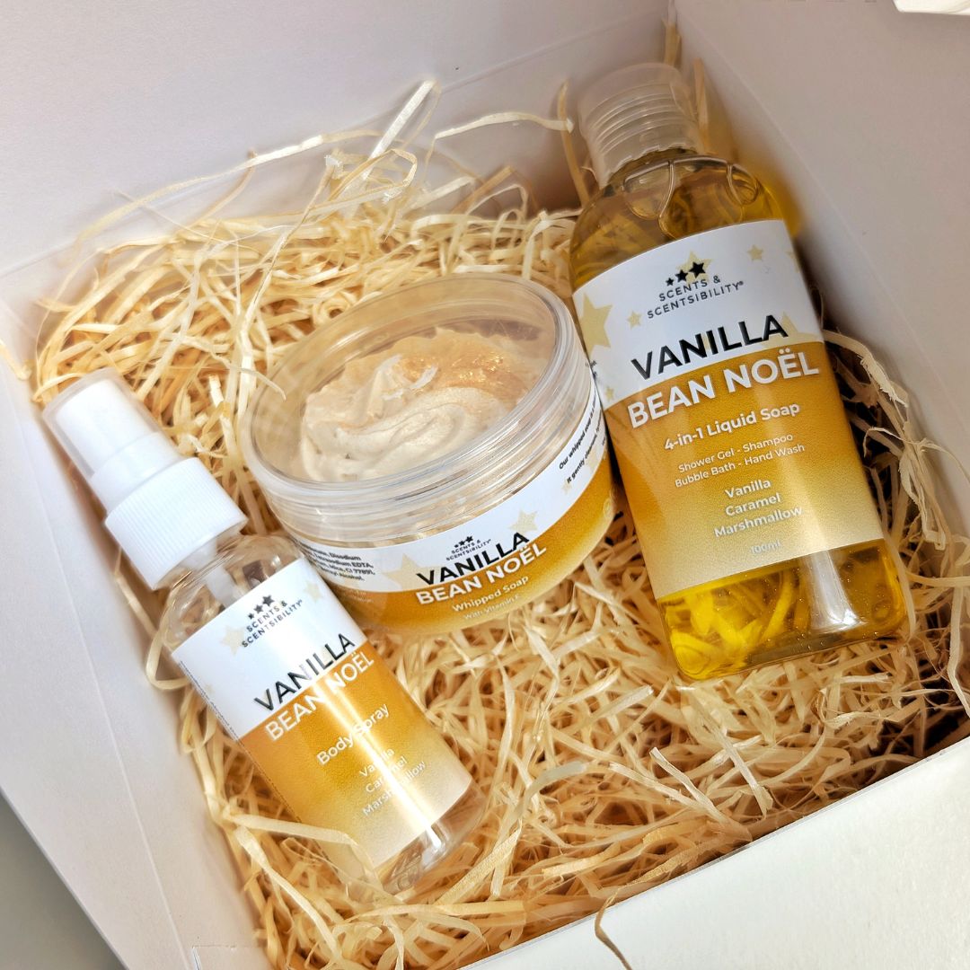 A box with wood wool and three Vanilla Bean Noël body products