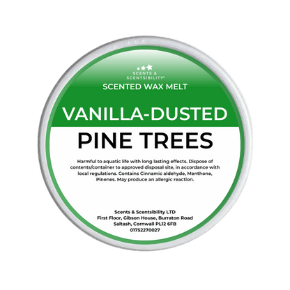 Scented wax melt container labeled 'Vanilla-Dusted Pine Trees' on a green background