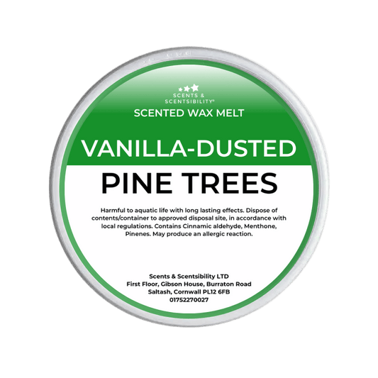 Scented wax melt container labeled 'Vanilla-Dusted Pine Trees' on a green background