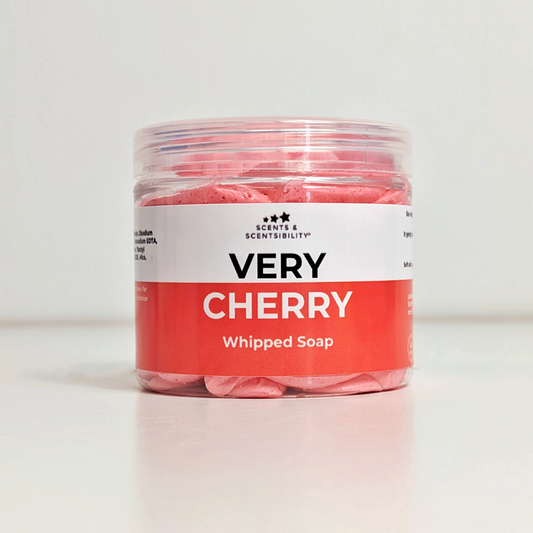 Jar of 'Very Cherry' whipped soap with a white label on a light background