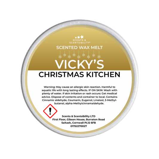 Vicky's Scented Wax Melt container with label on a green background