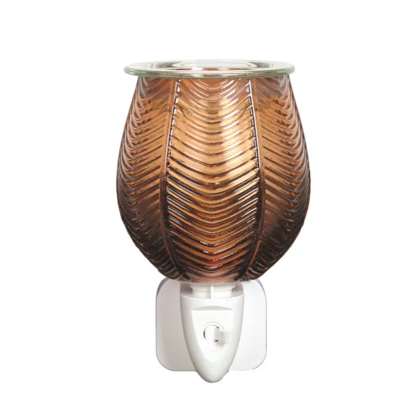 A copper-colored glass wax warmer with a ribbed leaf-like pattern and a white plastic plug-in base, shown against a plain white background.
