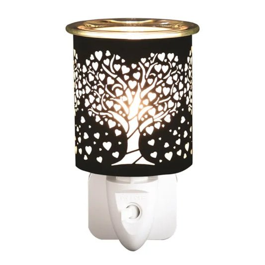 Decorative plug in wax melter with tree and heart design on a white background