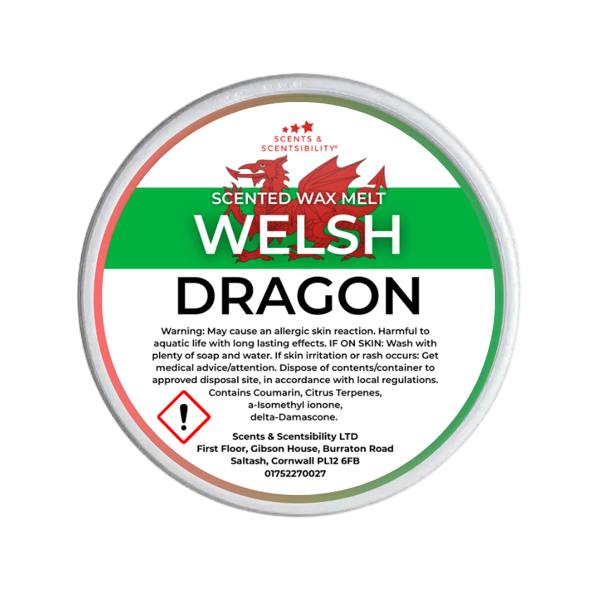 Scented wax melt container labeled 'Welsh Dragon' with branding and warning text on a green background.