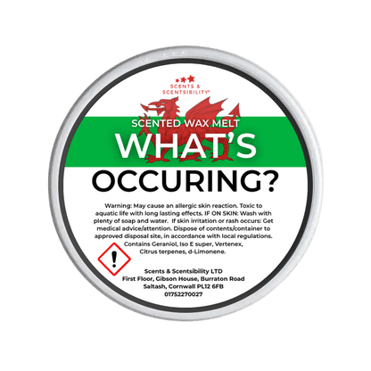 Scented wax melt container with label on a green background