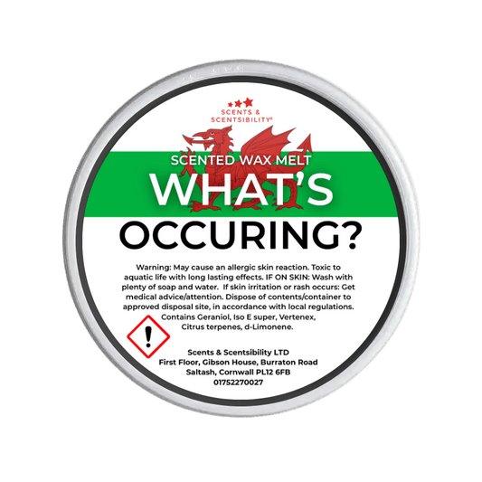 Scented wax melt container with label on a green background