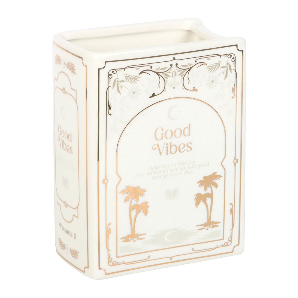 Decorative vase with 'Good Vibes' text and palm tree designs on a white background