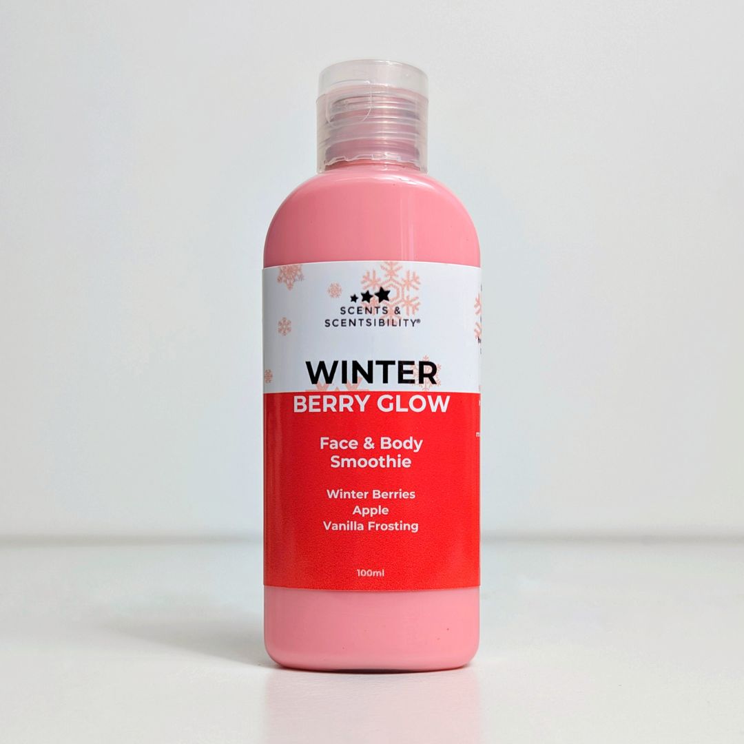Pink bottle of 'Winter Berry Glow' Face & Body Smoothie with a white label on a light gray background