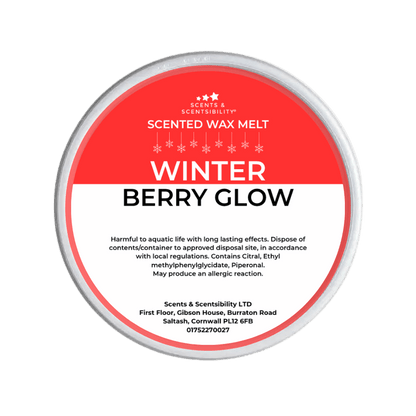 Scented wax melt container labeled 'Winter Berry Glow' on a green background
