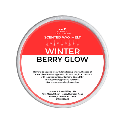 Scented wax melt container labeled 'Winter Berry Glow' on a green background