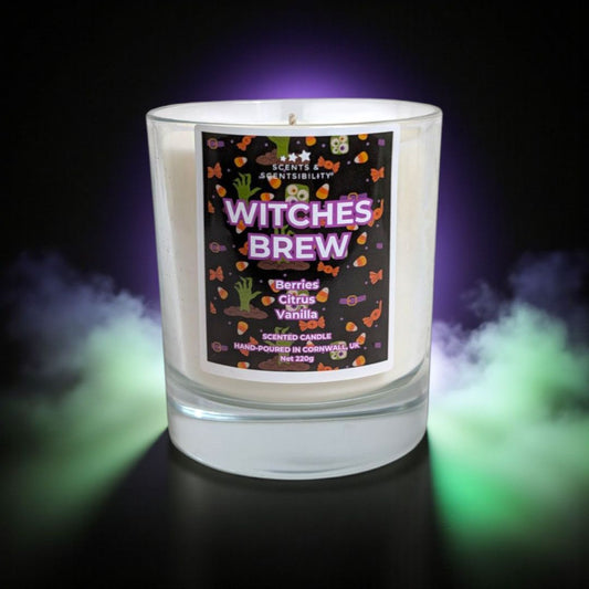 Candle labeled 'Witches Brew' with a dark background and colorful smoke effects