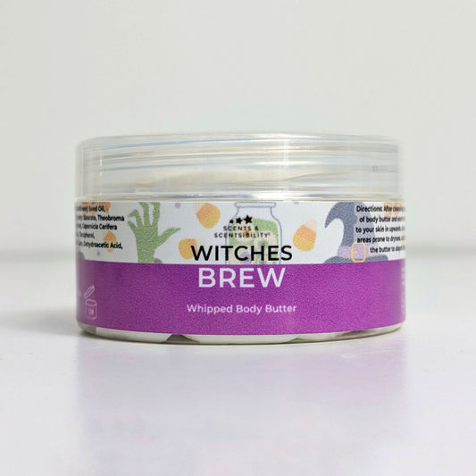 Jar of 'Witches Brew' whipped body butter with a purple label on a white background