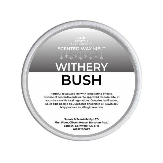 Scented wax melt container labeled 'Withery Bush' on a green background