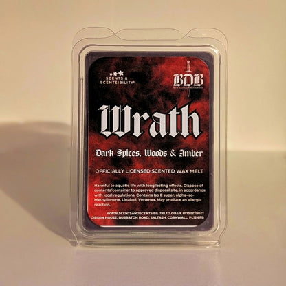 Scented wax melt package labeled 'Wrath' with branding on a beige background