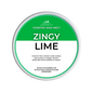 A round tin of Scents & Scentsibility Scented Wax Melt in the 'Zingy Lime' scent, featuring a green and white label with product details.