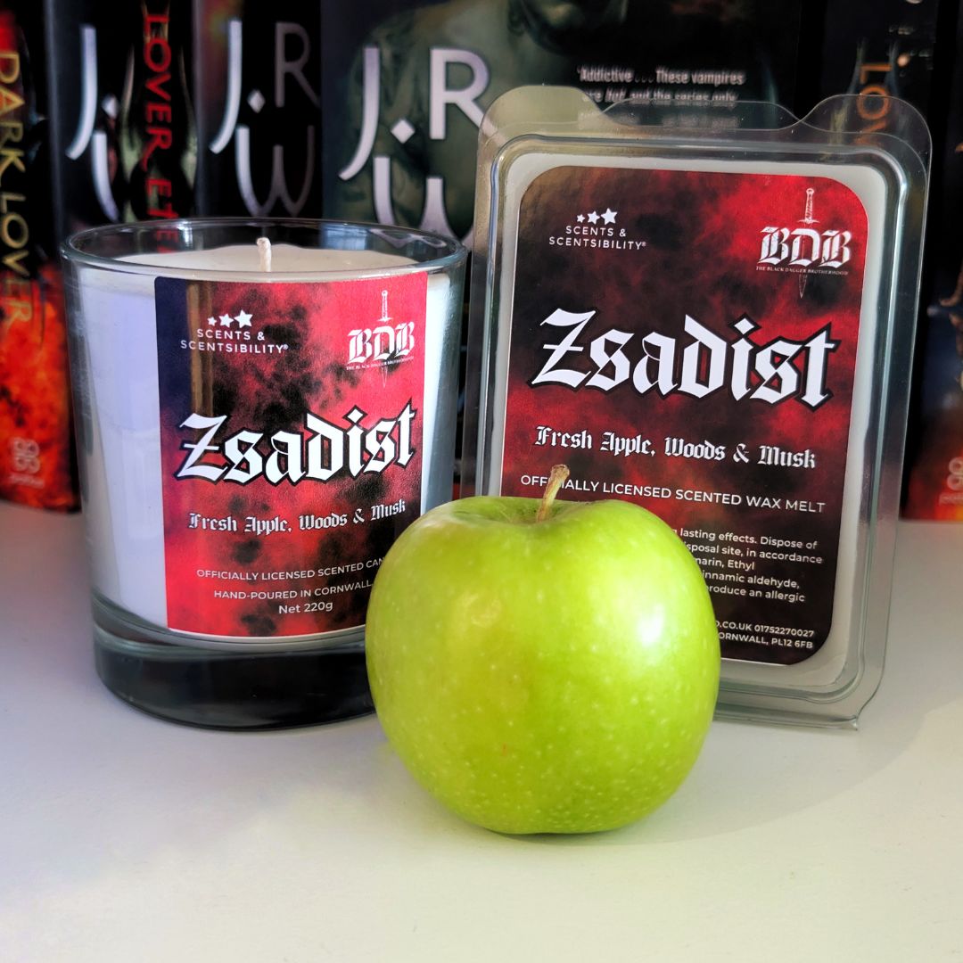 BDB 'Zsadist' scented candle and wax melt with a green apple on a white surface.