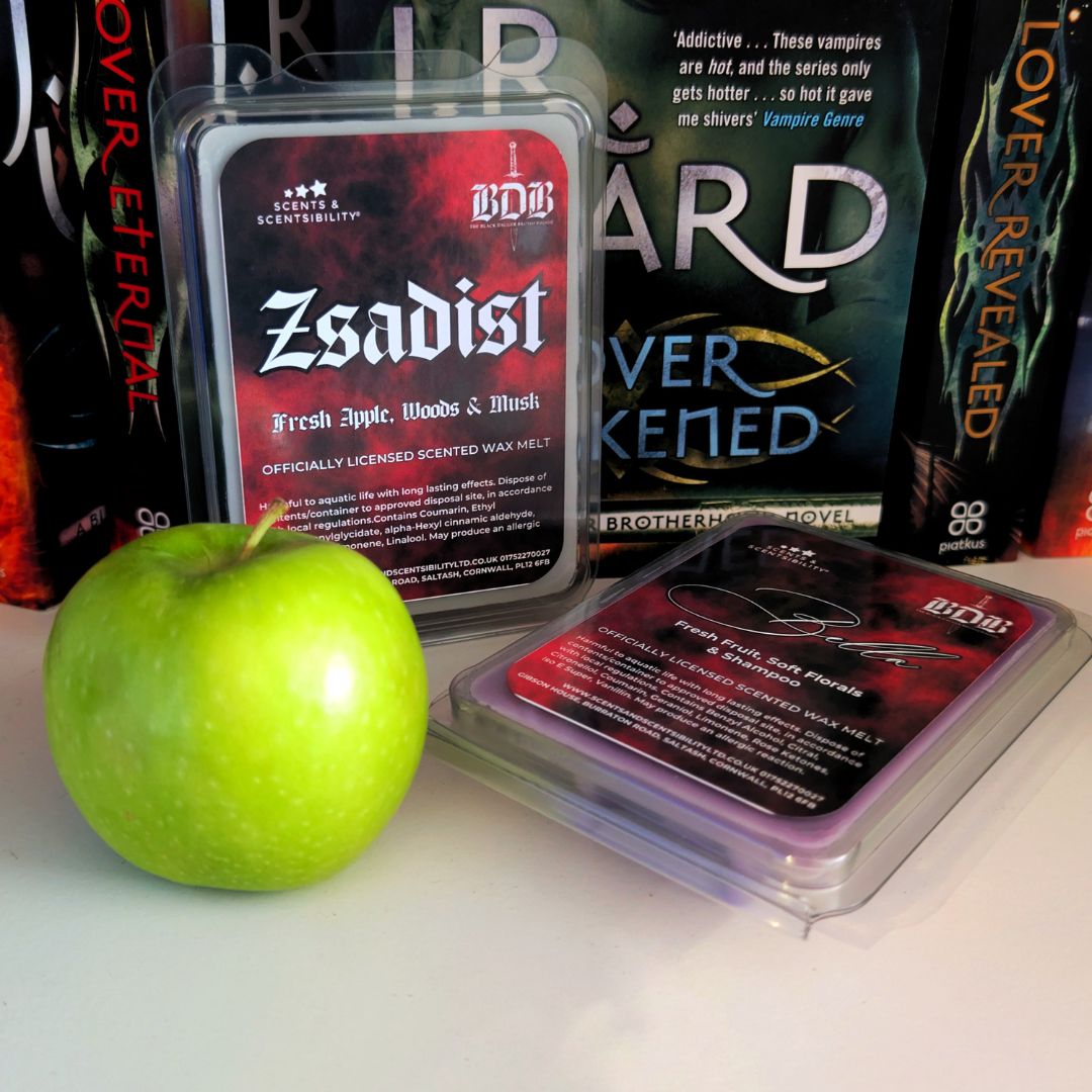 BDB Zsadist scented wax melts with a green apple on a white surface
